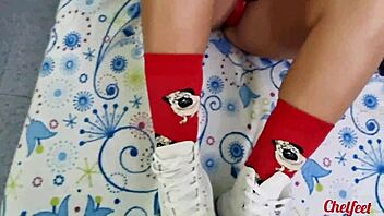 My girlfriend seduces me with her shoes and red socks, giving a footjob until I cum