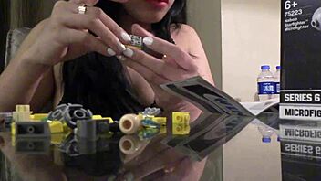 German Asian builds Lego in sexy POV.