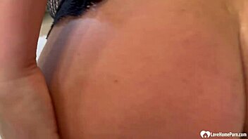 Asian MILF moans in pleasure while giving handjob