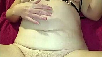 Man, my wife’s taking it hard in the ass! That huge plug in her cunt is just wild.