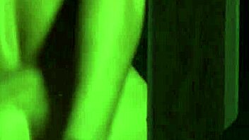 A stunning brunette indulges in self-pleasure, captivating viewers with her reflective gaze and sensual moves