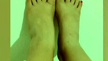 shy hottie with red pedicure shows off sexy legs for footjob on camera