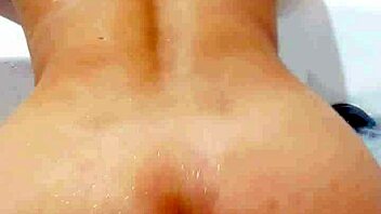 A petite Japanese wife twerking and showing her butt in a motel bathtub
