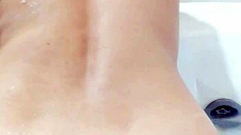 A petite Japanese wife twerking and showing her butt in a motel bathtub