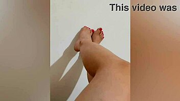 shy hottie with red pedicure shows off sexy legs for footjob on camera