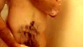 woman bathing in the shower, pissing and masturbating playfully with water.