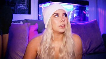 A submissive blonde performs a striptease revealing her small breasts and curvy figure