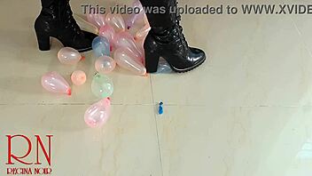 milf pops small balloons with her high heels and boots 😍