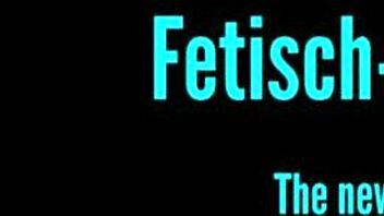 she's got a short cast on her leg in dominatrix outfit. piercing and tattoos visible