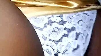 Black cock penetrates curly-haired vixen's panties in steamy bedroom session