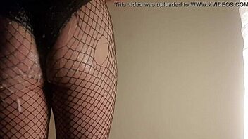 Fishnet babe shoves cucumber deep in juicy ass!