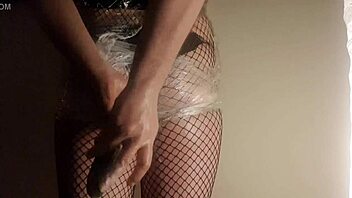 Fishnet babe shoves cucumber deep in juicy ass!