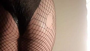 Fishnet babe shoves cucumber deep in juicy ass!