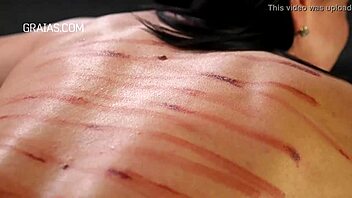 Wow! Watch this domina whip her redhead slave hard!