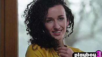 Petite curly teen model posed in kitchen.