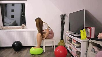 A girl enjoys playing with balloons in pantyhose and stockings