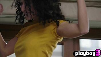 Petite curly teen model posed in kitchen.