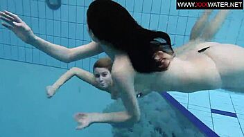 Andrea and her girlfriend Monika have fun in the pool