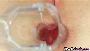 Babe spreads her hairy pussy and toys it close up.