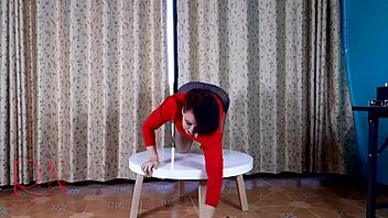 Nice lady strips in pantyhose and heels at round dorm table