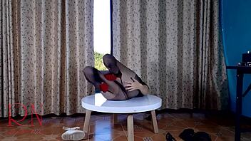 Nice lady strips in pantyhose and heels at round dorm table