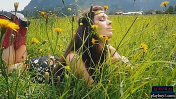 A busty brunette MILF relishes the beauty of nature and flowers outdoors