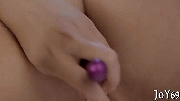 A sultry beauty indulges in self-pleasure