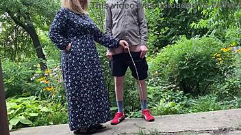 Beautiful mature woman assists a stranger in urinating outdoors and inadvertently urinates on herself