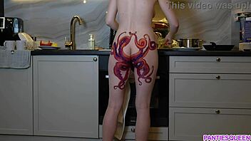 A barefoot woman with an octopus tattoo on her buttocks prepares dinner in the kitchen and disregards you