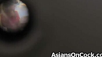 Two horny guys pleasure an Asian delivery woman in a steamy threesome