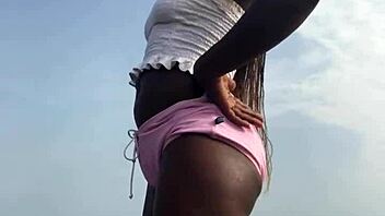 crazy bitch twerks hard in sexy clothes on outdoor beach with lesbian vibes