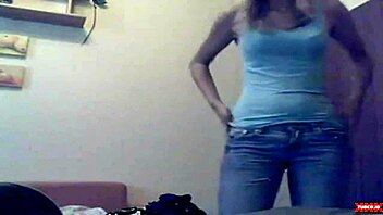 Watch teen undress on webcam striptease