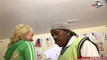A young American blonde with small breasts enjoys an interracial encounter with a big black cock