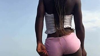 crazy bitch twerks hard in sexy clothes on outdoor beach with lesbian vibes