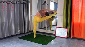 Regina Noir, a brunette amateur, performs yoga in yellow leggings at the gym