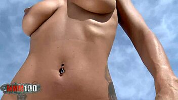 Coral Joice, a busty MILF, strips on the beach in outdoor fitness video