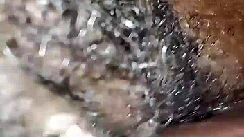Curly-haired beauty enjoys a steamy encounter