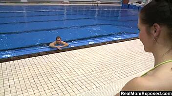 Hot milf enjoys a conversation with a fresh swimmer at the pool