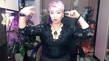 A stunning and mature woman with purple hair indulges in self-pleasure through her delicate lingerie