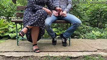 Outdoor handjob in a public setting