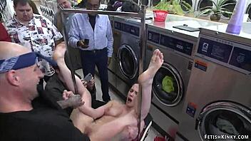 Amateur couple engages in kinky BDSM at laundromat