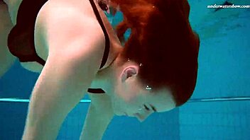 Czech babe Vesta dives naked into the swimming pool