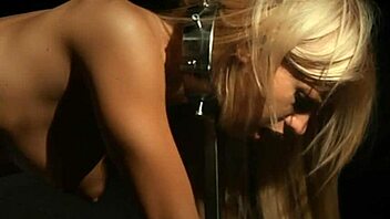 Bound and gagged blonde punished in slave-cage