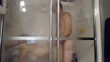 Husband and wife enjoy steamy shower play with toys