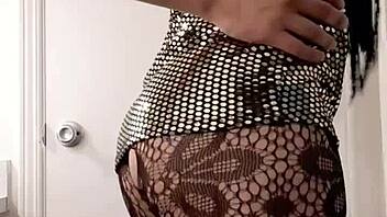 Hot crossdresser rocks sexy gold tight dress at home.