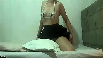 The prostitute rubs her perky ass on the pillow outdoors