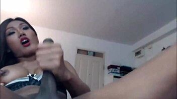 Stroking Her Big Hard Asian Shemale Cock in a Close-Up Young 18+ Scene.