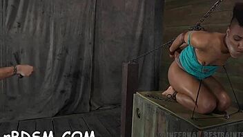 Inflicting joy on babe's cunt in bondage session