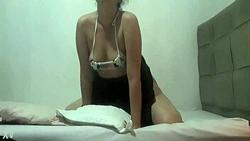 The prostitute rubs her perky ass on the pillow outdoors