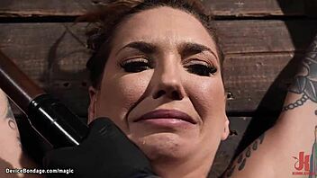 hey, wanna see this busty tattooed slave take a rough dildo?